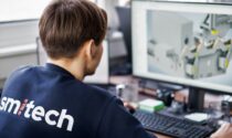 Engineer designing production line and looking at the screen